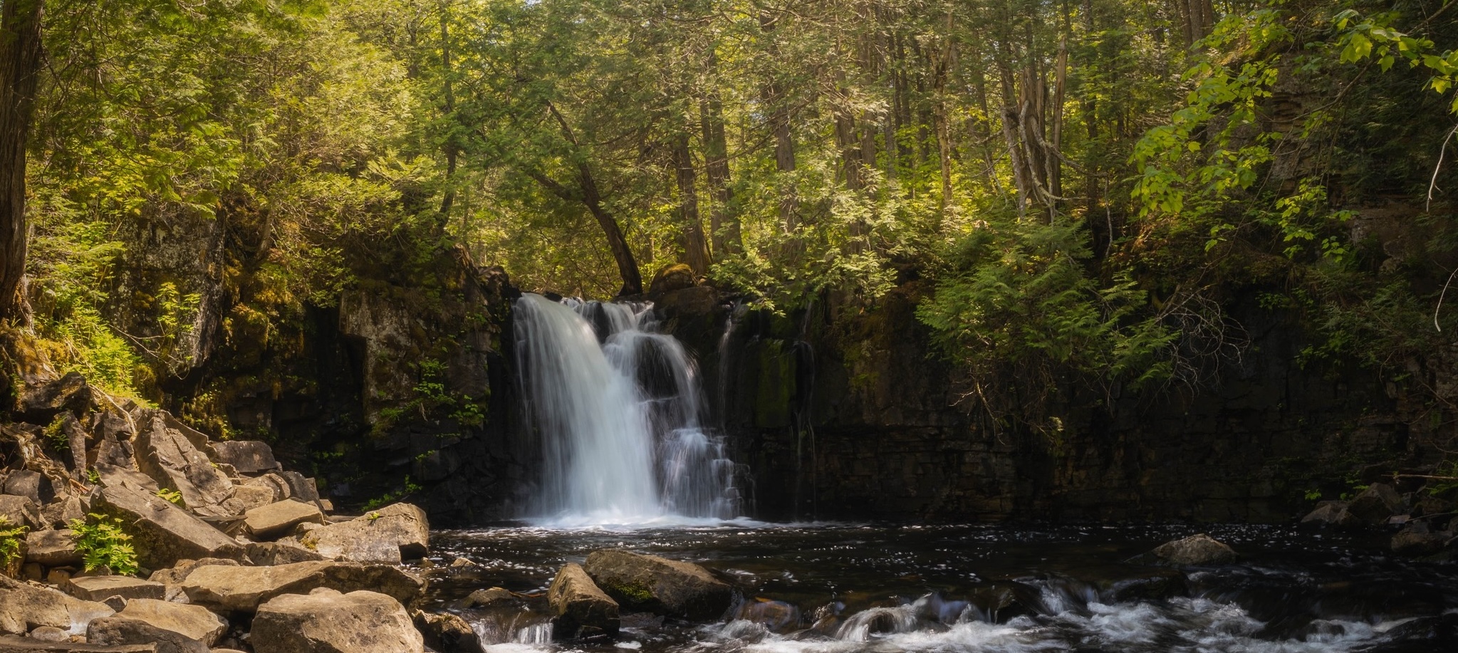 waterfall in the Boundary Waters Canoe Area Wilderness Minnesota surrounded by forest